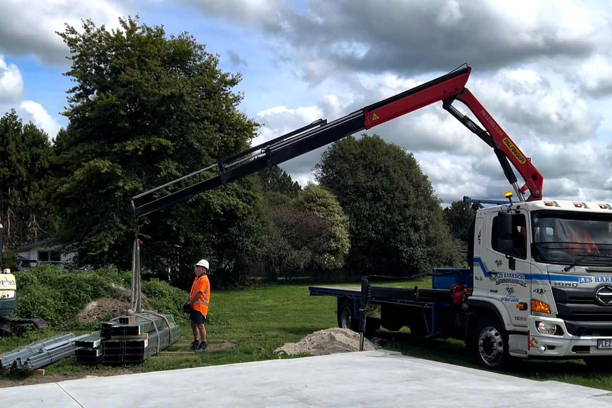 hiab truck delivering kitset shed framing components Hiab truck delivering kitset shed framing components to site